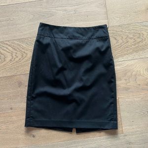 Banana Republic black wool pencil skirt. Side zipper. Fullly lined. Size 4P.